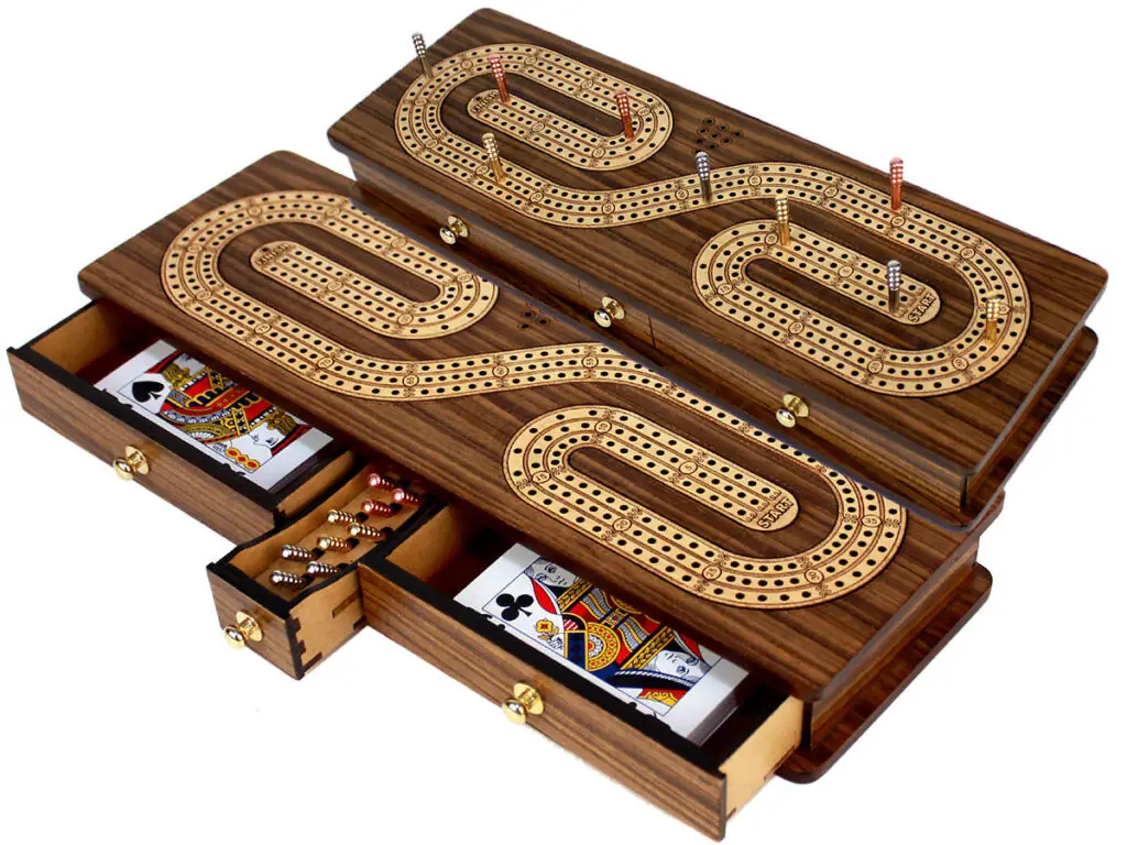 Wooden cribbage board set with pegs and storage holes